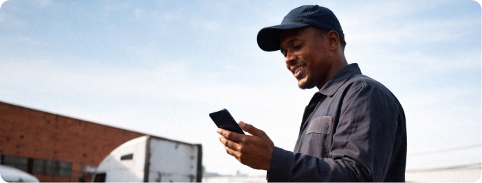 Truck Driver looking at phone